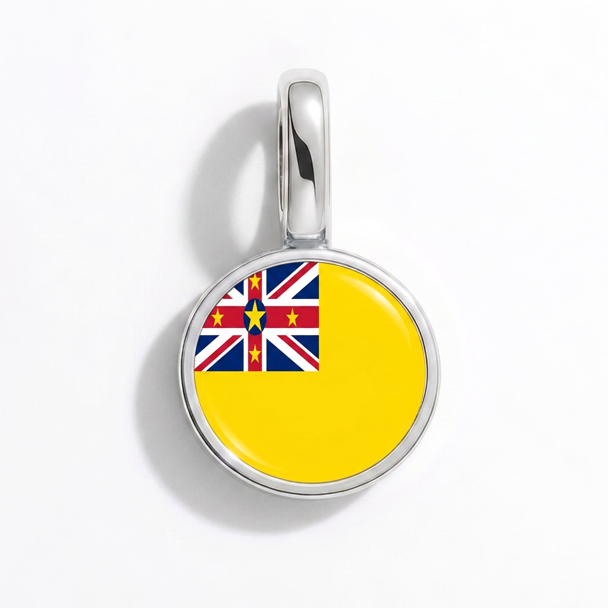 Charm bandera Niue – redonda plata
